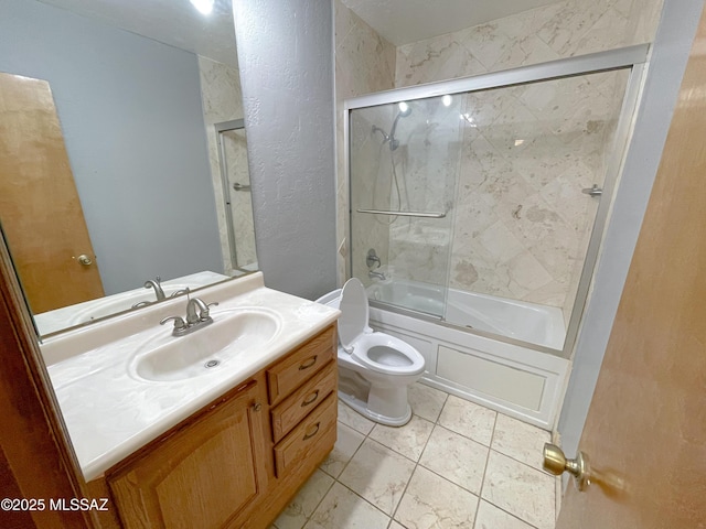 full bathroom with toilet, vanity, and shower / bath combination with glass door