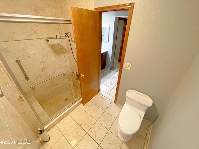 bathroom with tile patterned floors, toilet, and an enclosed shower