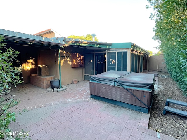 view of patio with a hot tub