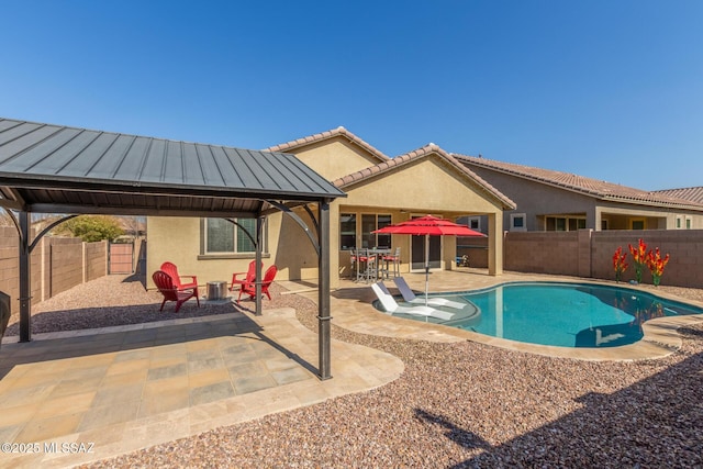 view of swimming pool featuring a gazebo and a patio