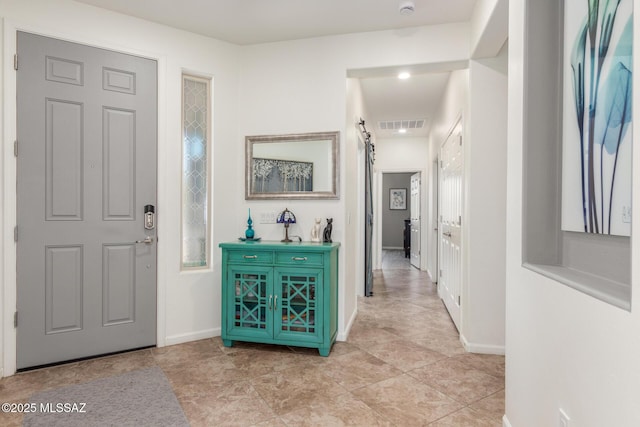 entrance foyer featuring a barn door