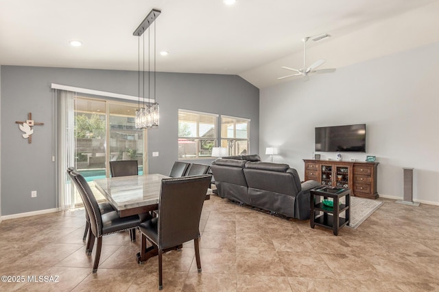 dining space featuring vaulted ceiling, light tile patterned flooring, and ceiling fan