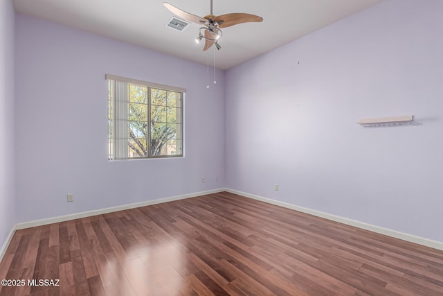 empty room featuring hardwood / wood-style flooring and ceiling fan