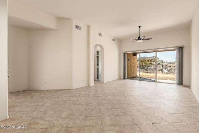 spare room with light tile patterned floors and ceiling fan