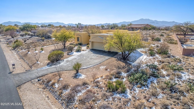 birds eye view of property with a mountain view