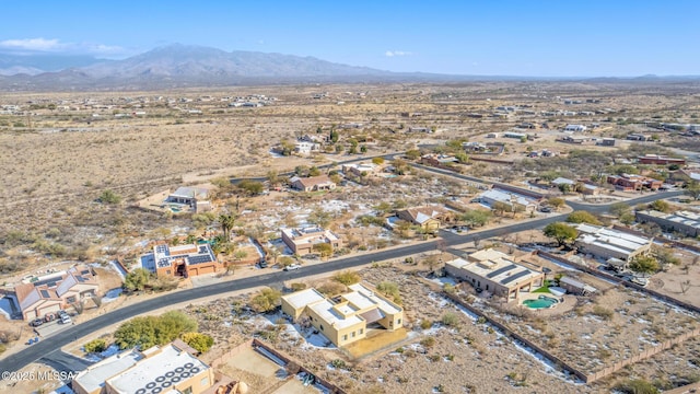 birds eye view of property featuring a mountain view