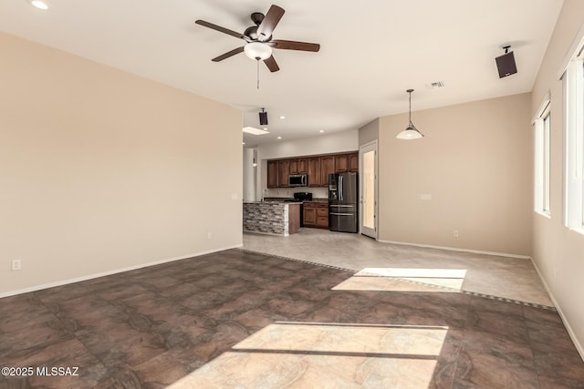 unfurnished living room with ceiling fan