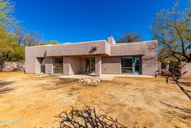 back of house featuring a patio area