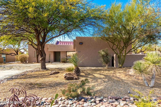 view of adobe home