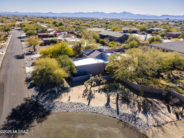 drone / aerial view featuring a mountain view