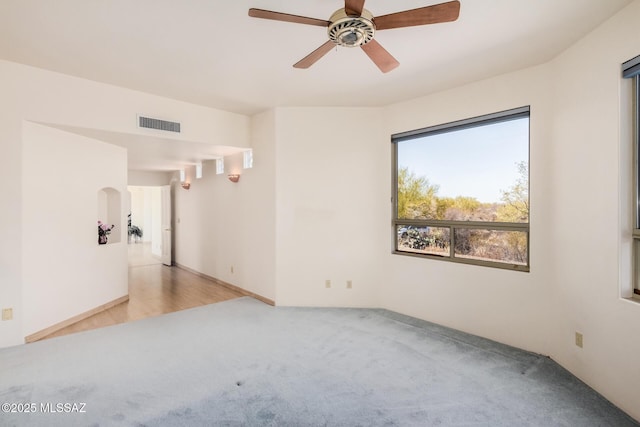 carpeted empty room with ceiling fan