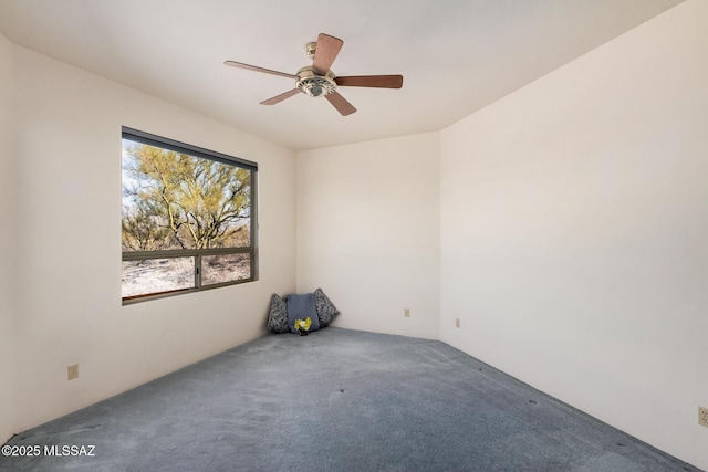 unfurnished room featuring carpet and ceiling fan