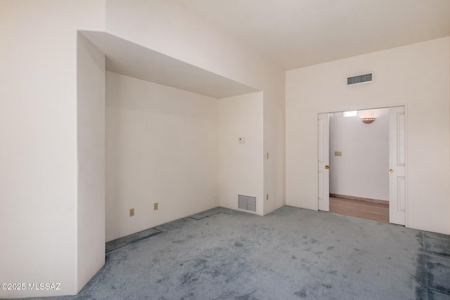 spare room with light colored carpet