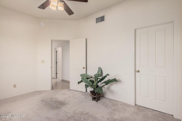 empty room with light carpet and ceiling fan