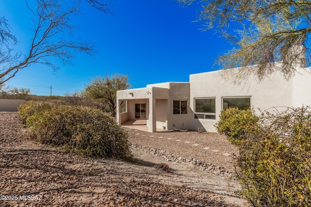 view of home's exterior with a patio area