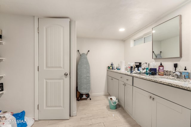 bathroom featuring vanity and hardwood / wood-style floors