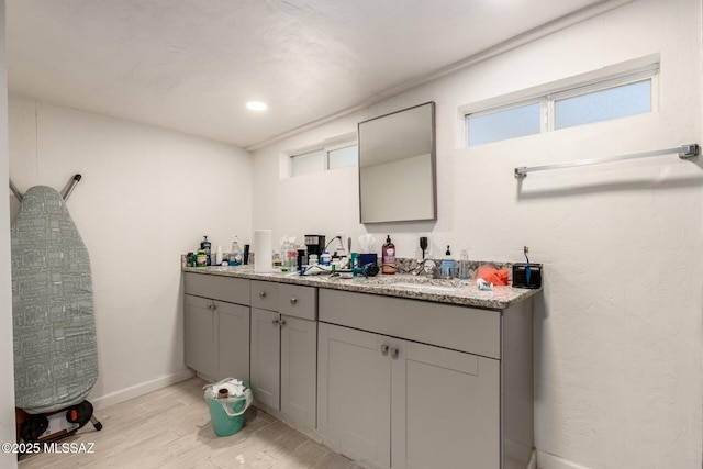 bathroom with wood-type flooring and vanity