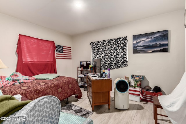 bedroom with light wood-type flooring