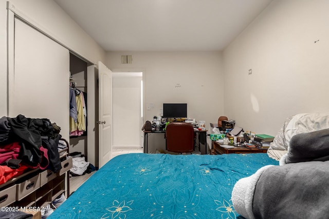 bedroom with wood-type flooring