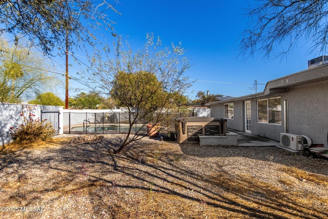 view of yard featuring a pool, ac unit, and a patio