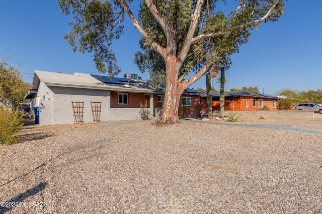 view of front of house featuring solar panels