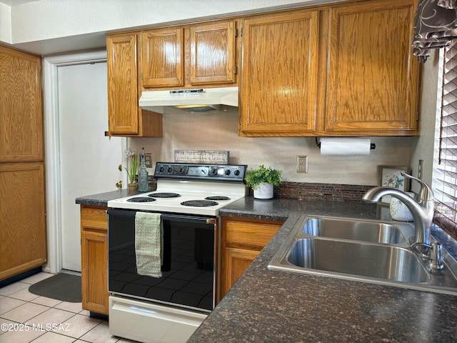 kitchen with sink, light tile patterned floors, and electric range