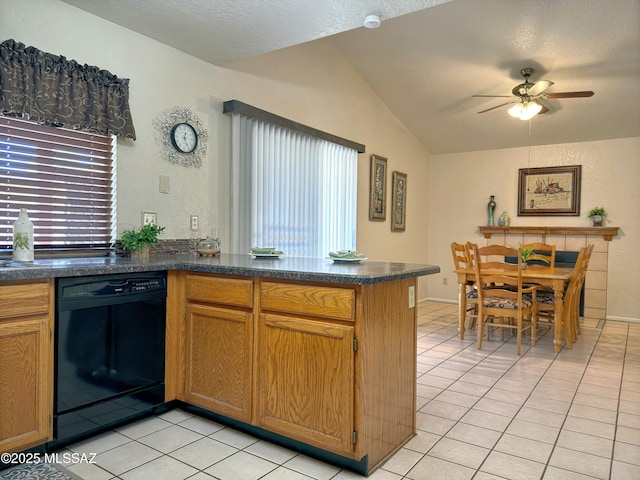 kitchen featuring vaulted ceiling, kitchen peninsula, black dishwasher, and light tile patterned flooring