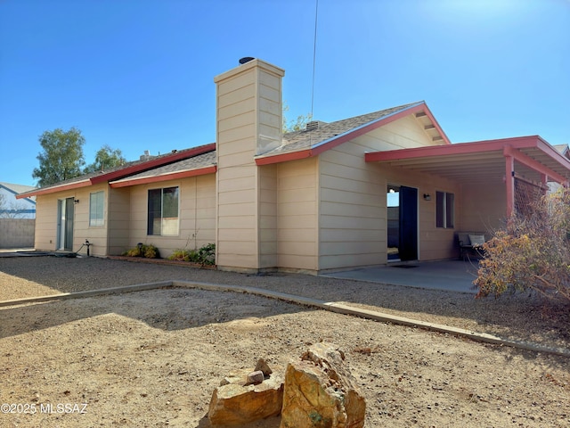 back of property with a patio area