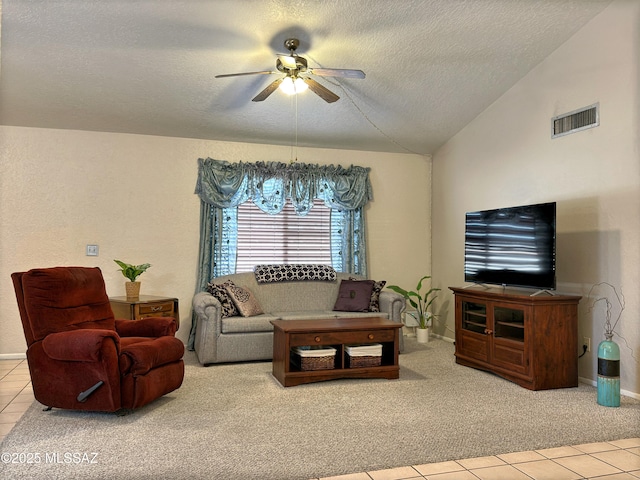 carpeted living room featuring ceiling fan with notable chandelier, vaulted ceiling, and a textured ceiling