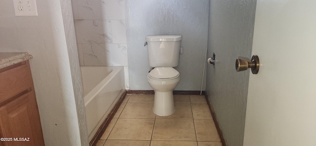 bathroom featuring tile patterned flooring, vanity, and toilet