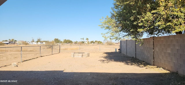 view of yard with a rural view