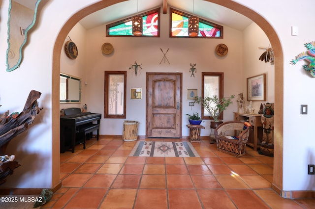925 N Rancho Del Jefe Loop, Tucson, AZ 85748 - entrance foyer with arched walkways, tile patterned floors, high vaulted ceiling, and baseboards