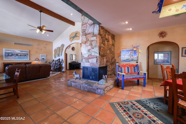 925 N Rancho Del Jefe Loop, Tucson, AZ 85748 - tiled living area featuring arched walkways, beamed ceiling, ceiling fan, and high vaulted ceiling