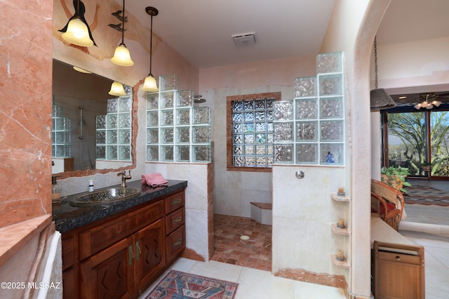 925 N Rancho Del Jefe Loop, Tucson, AZ 85748 - full bathroom with a walk in shower, vanity, and tile patterned floors