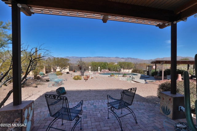 925 N Rancho Del Jefe Loop, Tucson, AZ 85748 - view of patio / terrace with a mountain view and an outdoor pool