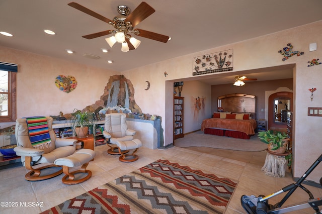 925 N Rancho Del Jefe Loop, Tucson, AZ 85748 - tiled living area with ceiling fan, arched walkways, recessed lighting, and baseboards