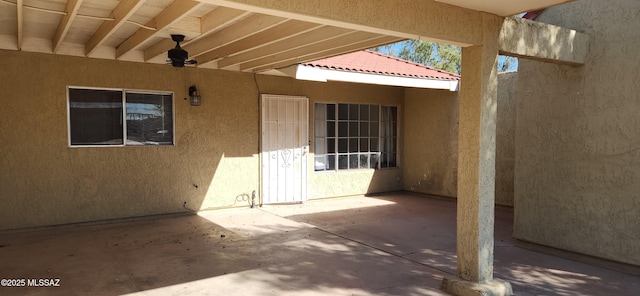 view of patio featuring ceiling fan