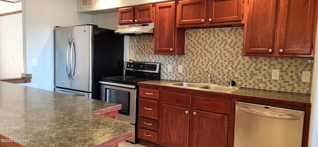 kitchen with tasteful backsplash, sink, and stainless steel appliances