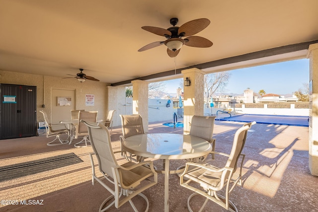 view of patio / terrace featuring a community pool and ceiling fan