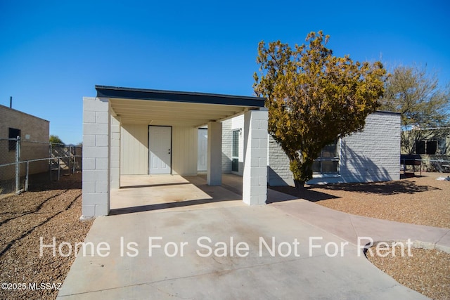 exterior space featuring a carport