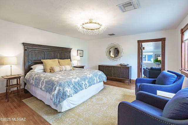 bedroom with hardwood / wood-style floors