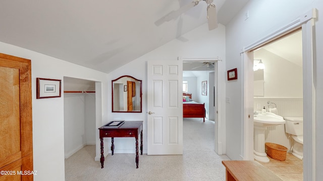 corridor with vaulted ceiling