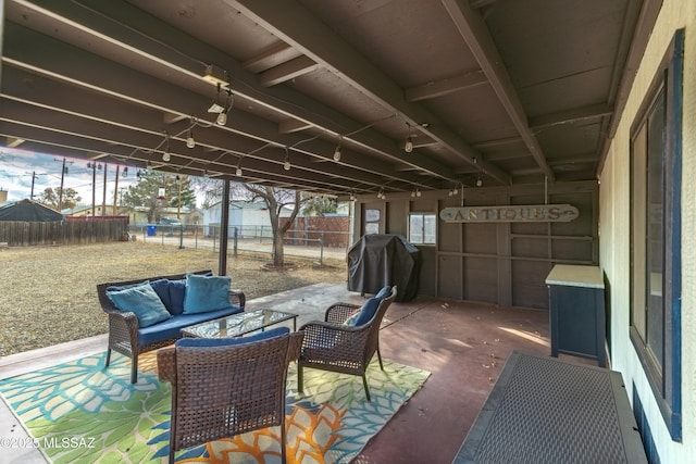 view of patio with outdoor lounge area and a grill