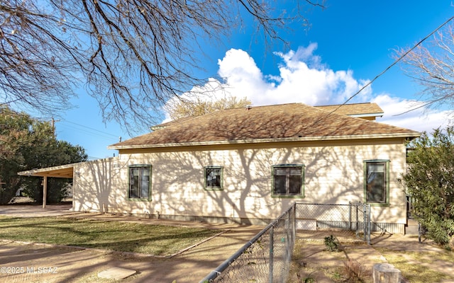 view of home's exterior featuring a carport