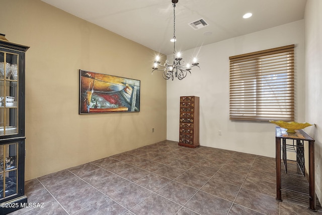 unfurnished dining area with a chandelier and visible vents
