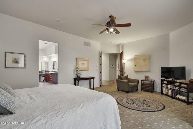 carpeted bedroom featuring visible vents
