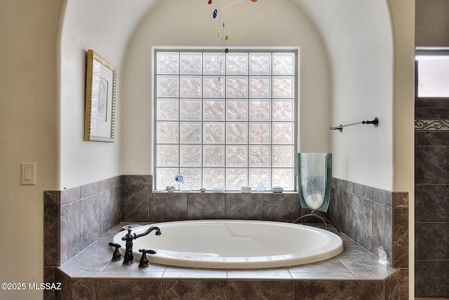 full bathroom with a bath