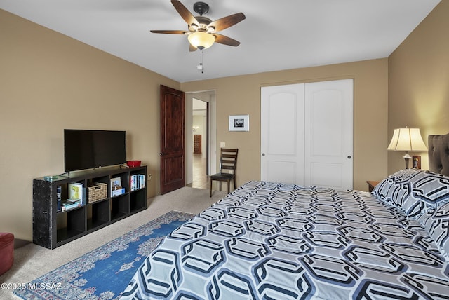 bedroom with carpet, a closet, and ceiling fan