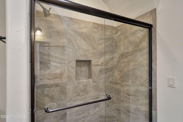 full bath featuring a shower stall