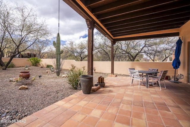 view of patio / terrace with a fenced backyard and outdoor dining area